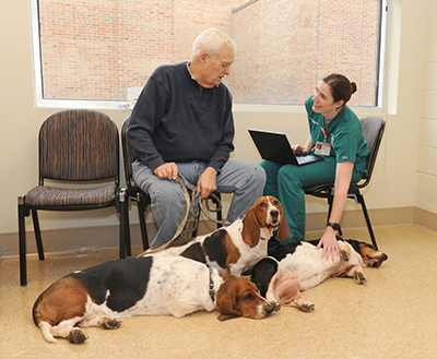 Dr. Maryanne Murphy consults a client and multiple patients for an obesity study appointment.
