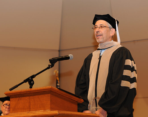 Walter Clark, DVM, DABVP Grassmere Animal Hospital, Nashville Tennessee speaking in front a podium.
