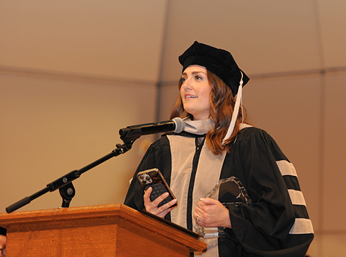 Molly Brinkmann, DVM Beauchamp Animal Hospital Franklin, Tennessee speaking at a podium.