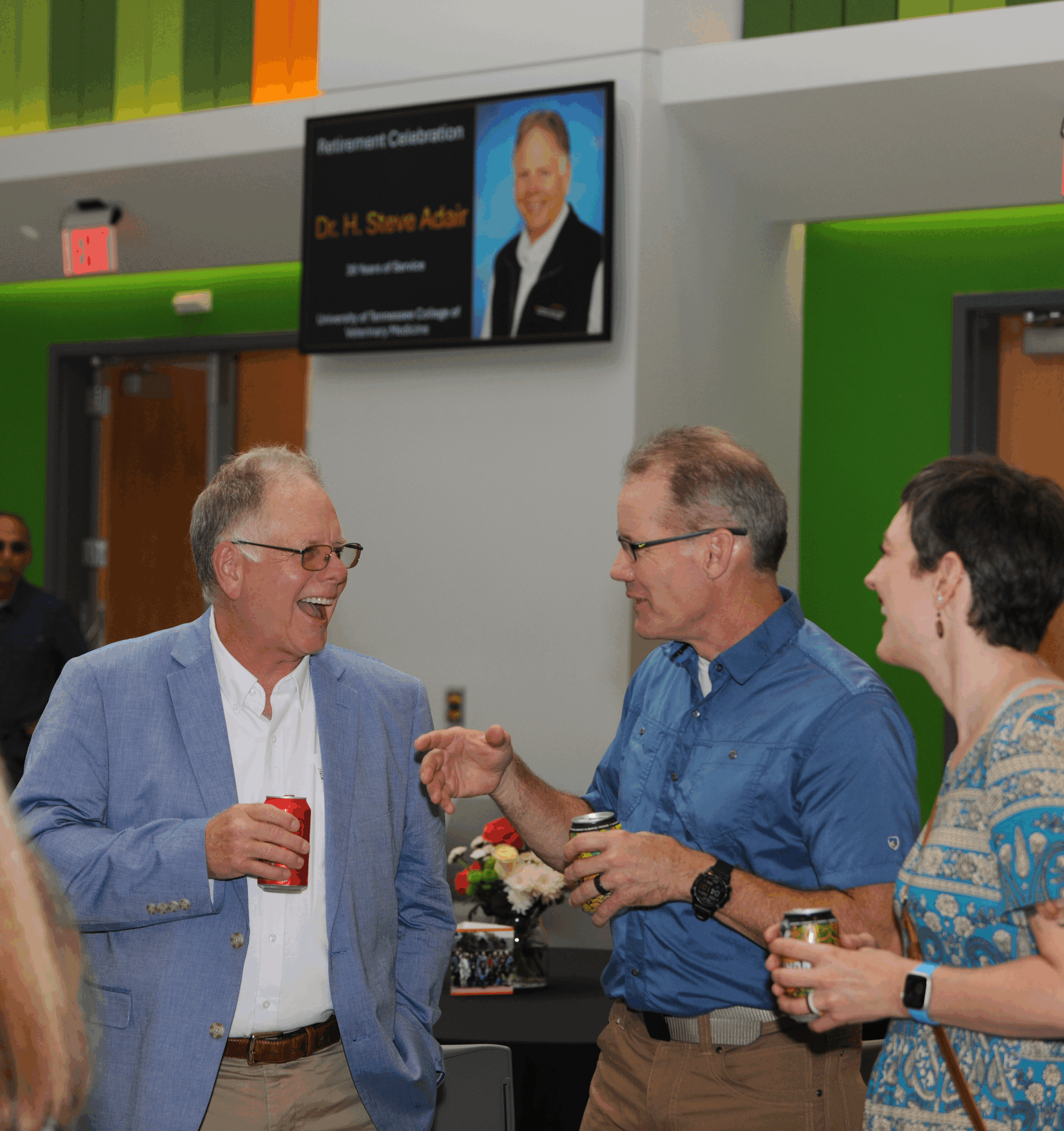 Dr. Steve Adair at his Retirement Celebration talking with guests.