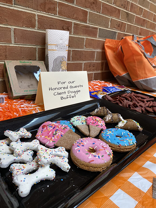 Celebration of life with owners and pets, there is a buffet of treats for the dogs, bones, donuts and jerky treats.