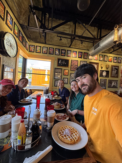 Eating the famous waffles at Aretha Frankenstein's in South Knoxville after the last farm call.