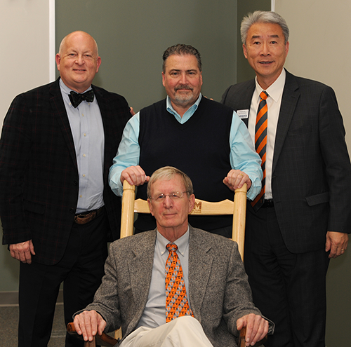 Dr. Thompson enjoys his custom UTCVM rocking chair presented to 
him at his UTIA retirement celebration. Joining him are Keith Carver, 
UTIA Senior Vice Chancellor and Senior Vice President; David White, 
Interim Dean, Herbert College of Agriculture; and Hongwei Xin, Dean 
of AgResearch.