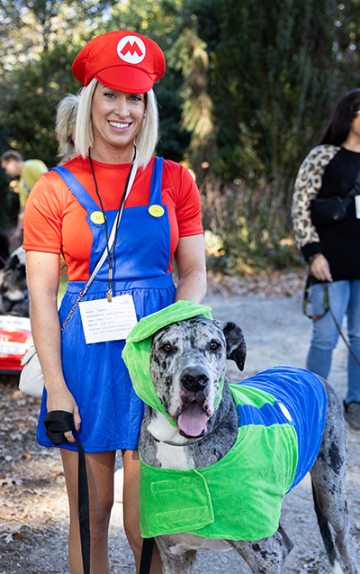 A great Dane dressed up as Mario with owner.