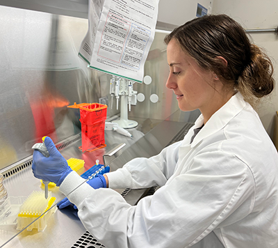 A student in the lab preparing for Research Day 2024.