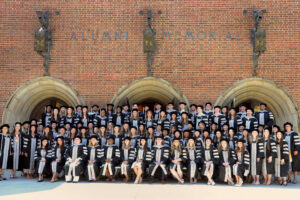Picture of Class of 2025 in front of the Alumni Memorial Hall.