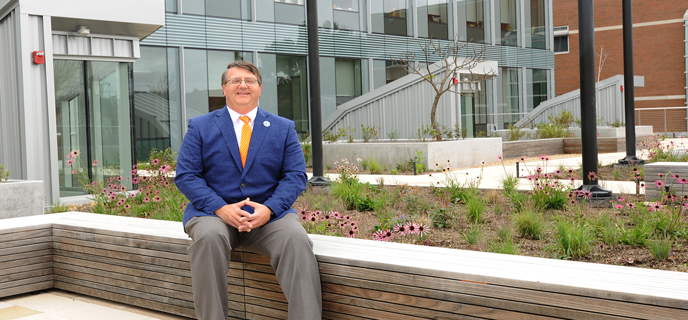 Dr Plummer sitting in the open area of the new ANR building.