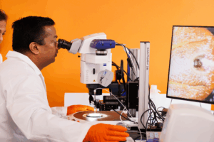 Girish Neelakanta and Hameeda Sultana, professors and vector borne disease researchers in a laboratory.