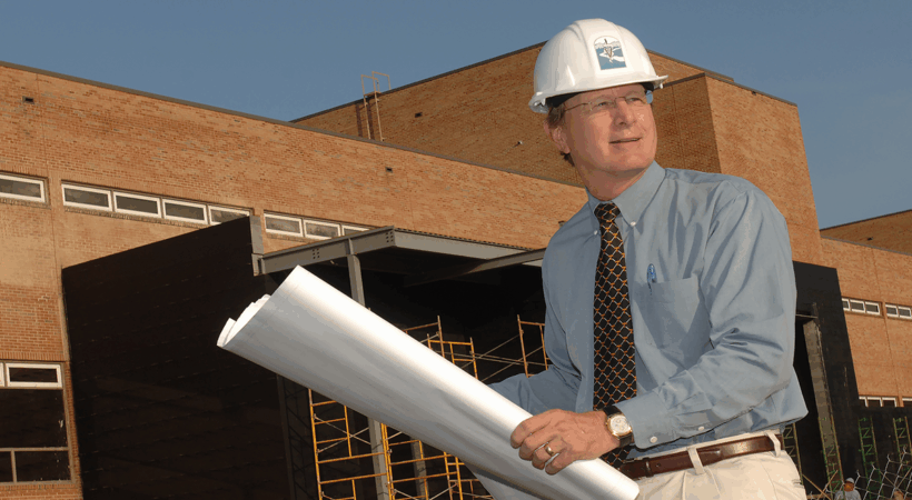 Dr. Jim Thompson looks over blueprints during construction of the John and Ann Tickle Small Animal Hospital expansion.