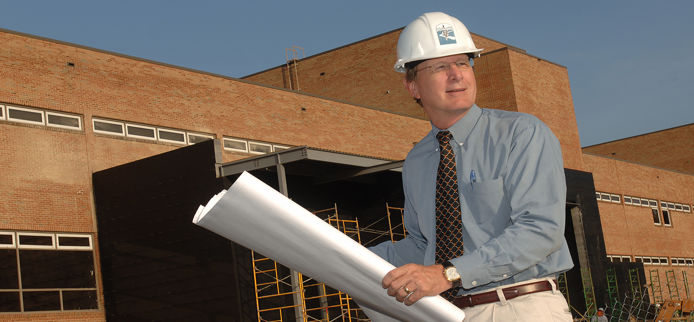 Dr. Jim Thompson looks over blueprints during construction of the John and Ann Tickle Small Animal Hospital expansion.